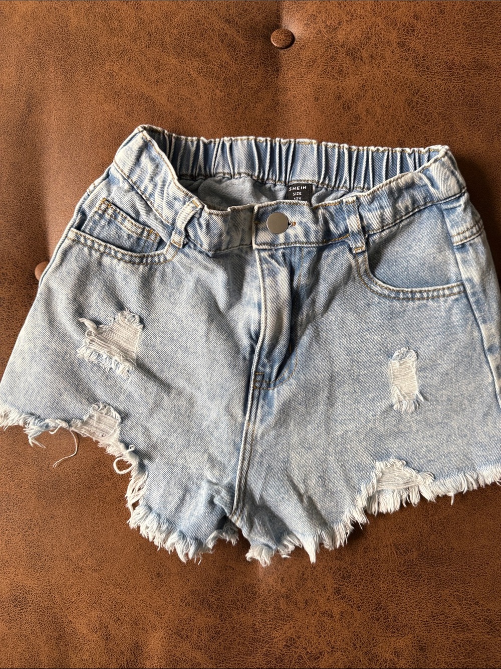 SHEIN Light Blue Distressed Denim Ruffle Waist Shorts